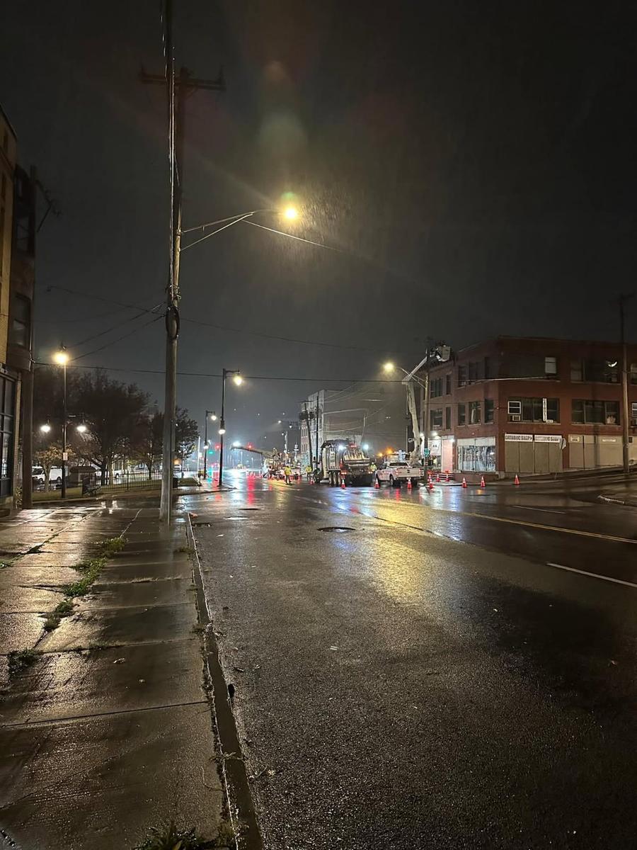 Downtown intersection work zone at night in the rain
